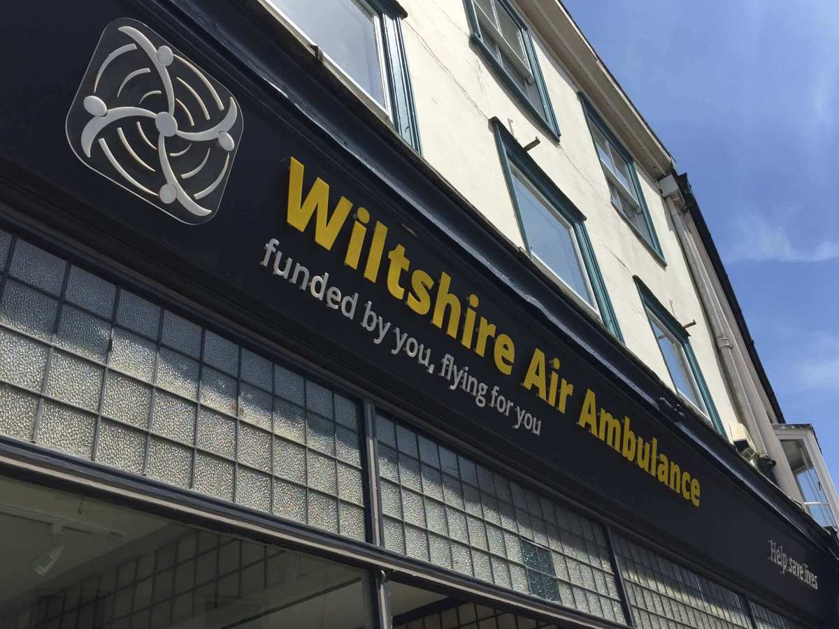 Wiltshire Air Ambulance's Devizes charity shop signage with yellow and white writing