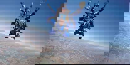 A skydiver in the air over Wiltshire county side. A skydiver in the air over Wiltshire county side.