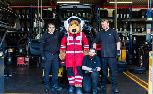 Teddy The Air Ambulances UK Mascot Joined The Kwik Fit Borehamwood Team To Mark The New Charity Partnership on Kwik Fit and Air Ambulances UK announce new national partnership