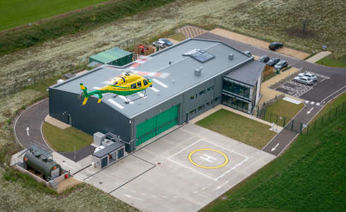 An aerial photo of the Bell-429 helicopter coming in to land at the charity's airbase.