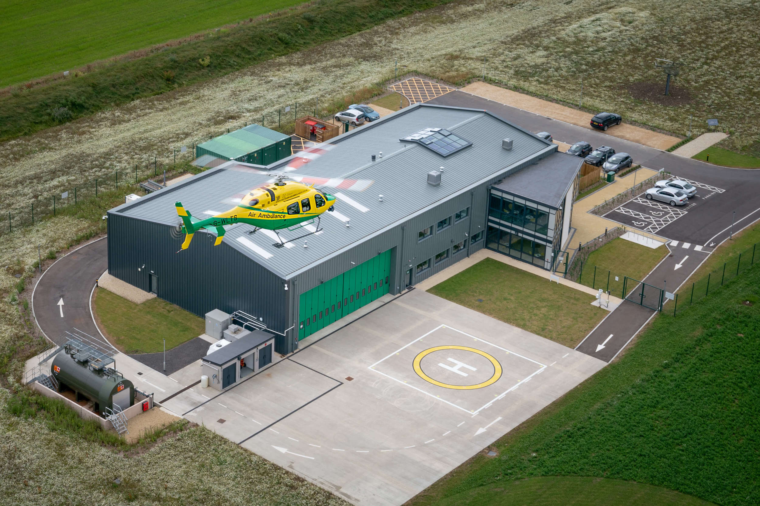 An aerial photo of the Bell-429 helicopter coming in to land at the charity's airbase.