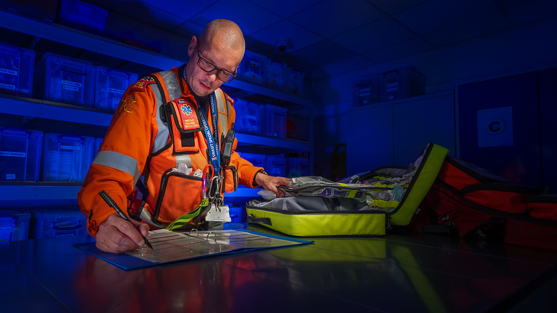 A paramedic working in the drugs store room at the airbase A paramedic working in the drugs store room at the airbase