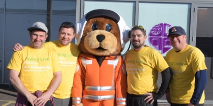 A group of staff from Excalibur with charity mascot Wilber