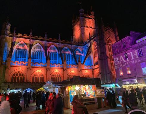 The exterior of Bath Abbey lit up with Christmas lights