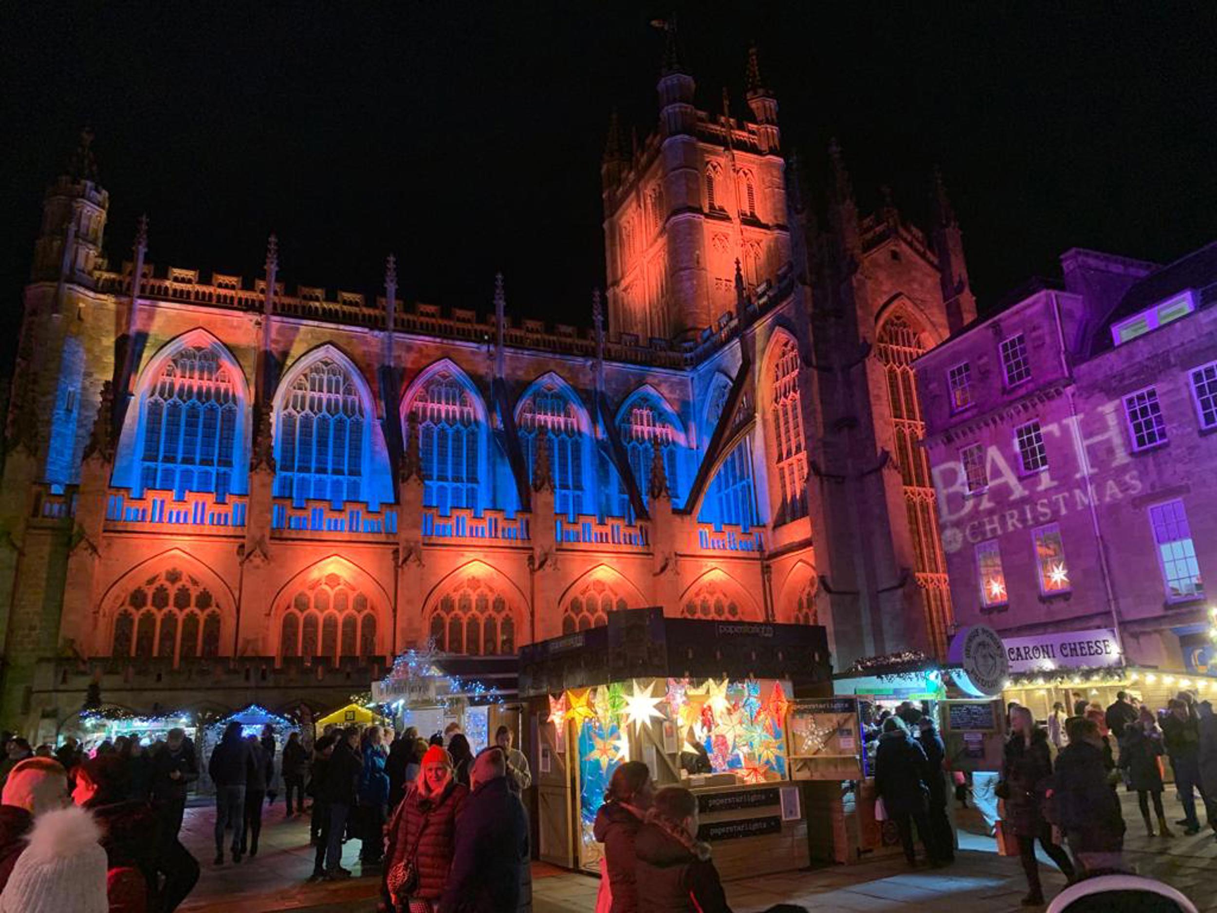 The exterior of Bath Abbey lit up with Christmas lights