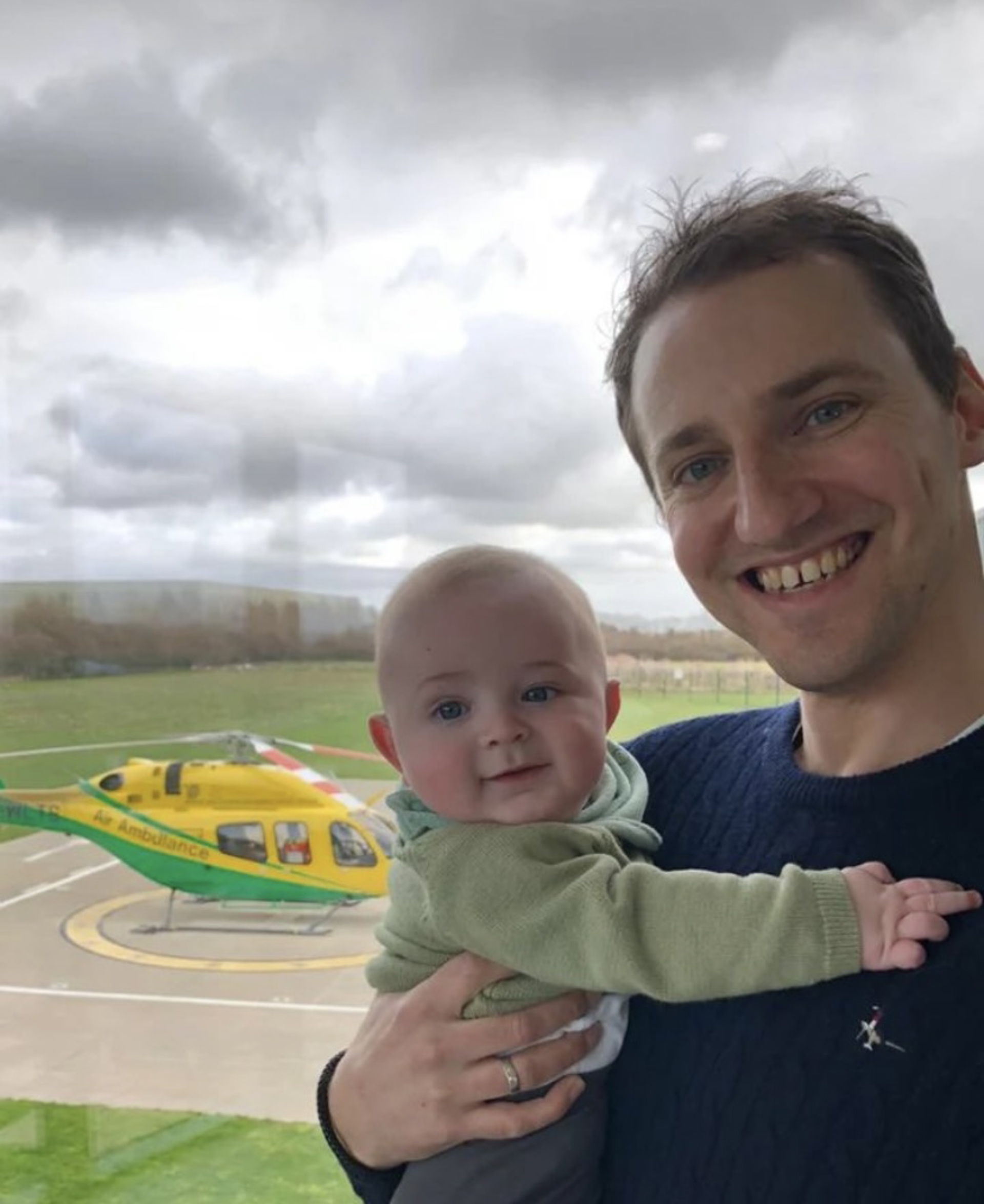 Former patient Pete Burch holding his baby, Albie