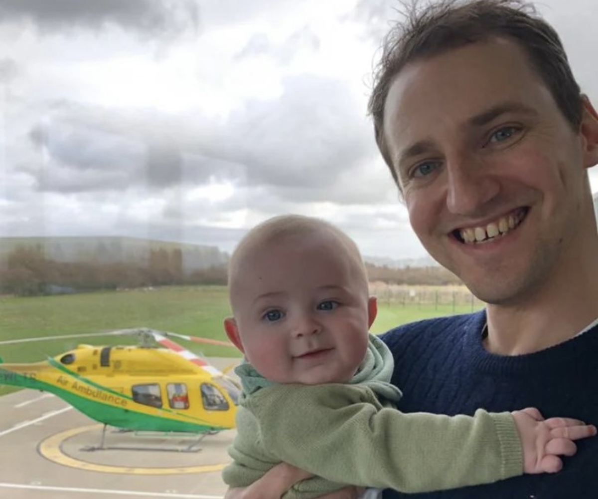 Former patient Pete Burch holding his baby, Albie