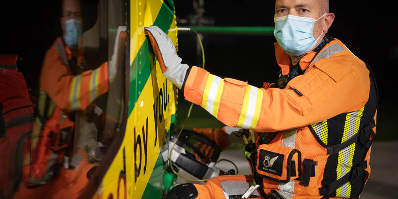 A paramedic refuelling the helicopter