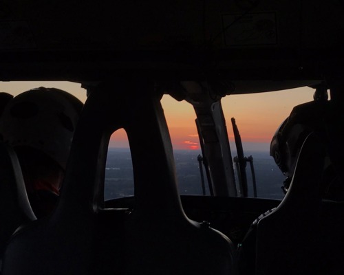 Sunset view from inside of a helicopter