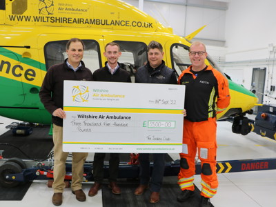 The Jockey Club presenting Paramedic Keith Mills with a cheque of £3,500 standing in front of the Wiltshire Air Ambulance helicopter The Jockey Club presenting Paramedic Keith Mills with a cheque of £3,500 standing in front of the Wiltshire Air Ambulance helicopter