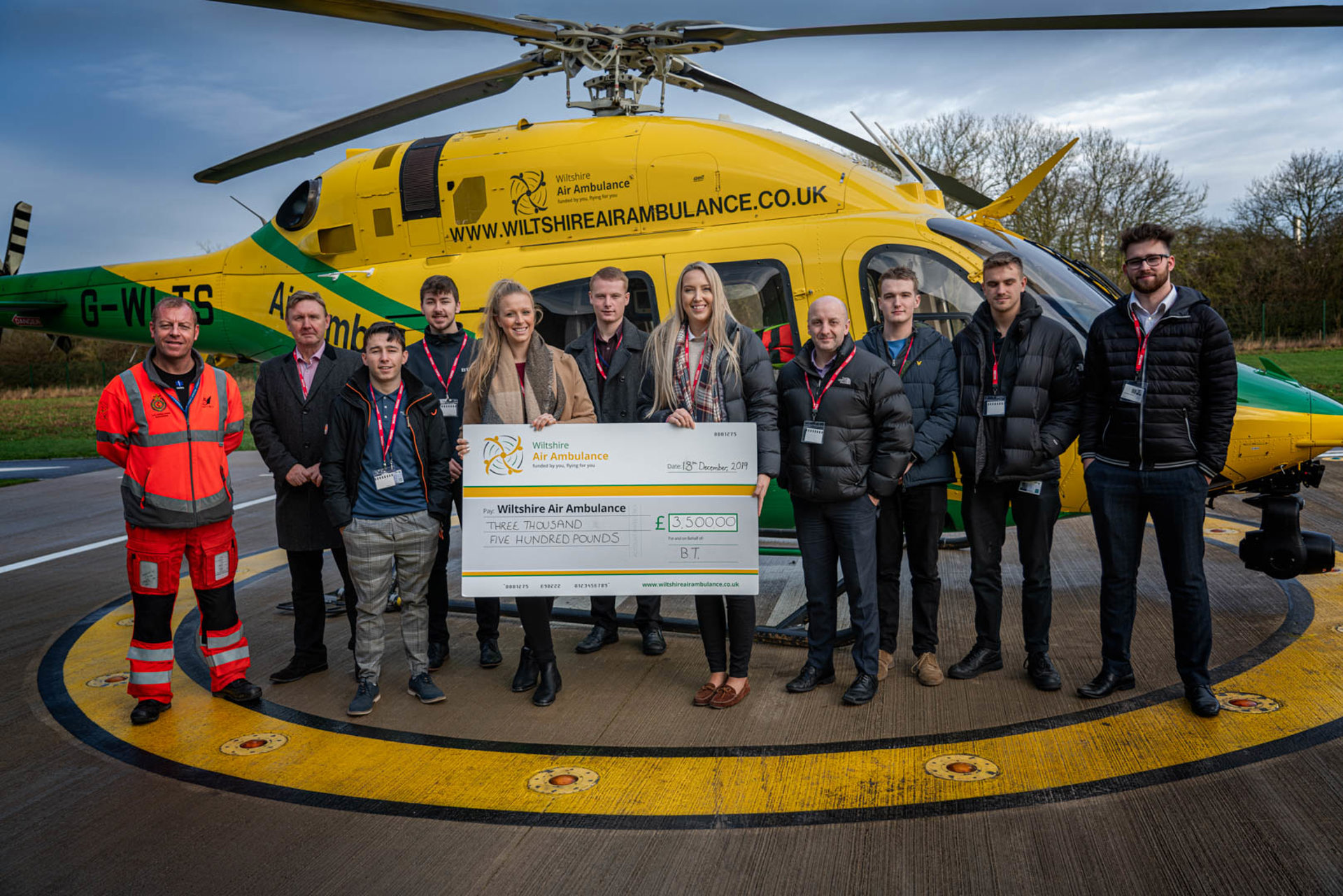 Staff from BT at a cheque presentation at WAA's airbase Staff from BT at a cheque presentation at WAA's airbase