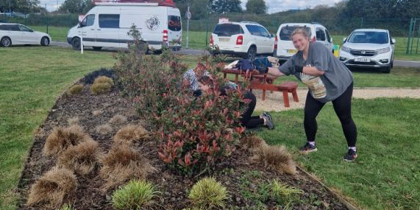 A member of Fexco staff volunteering at the airbase by gardening A member of Fexco staff volunteering at the airbase by gardening