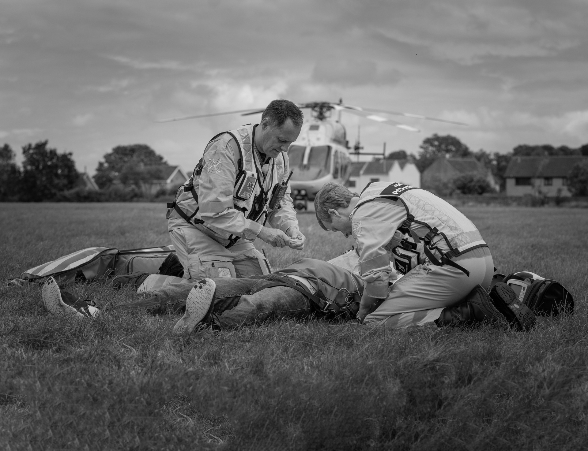 A staged incident in a field where the helicopter has landed nearby