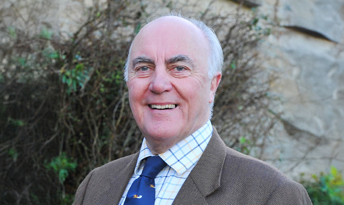 A headshot of Richard Youens stood outside