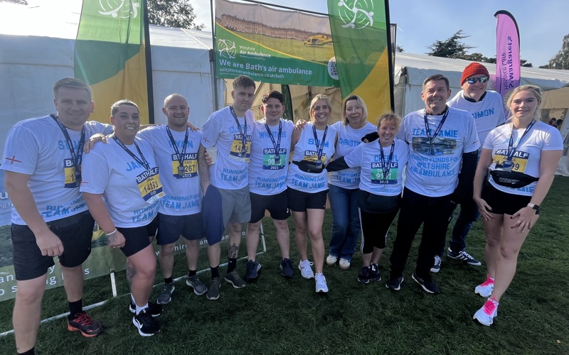 A group of runners with Bath Half Marathon medals