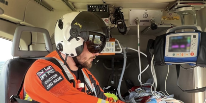 Dr Jono Holme delivering drugs to a patient in flight