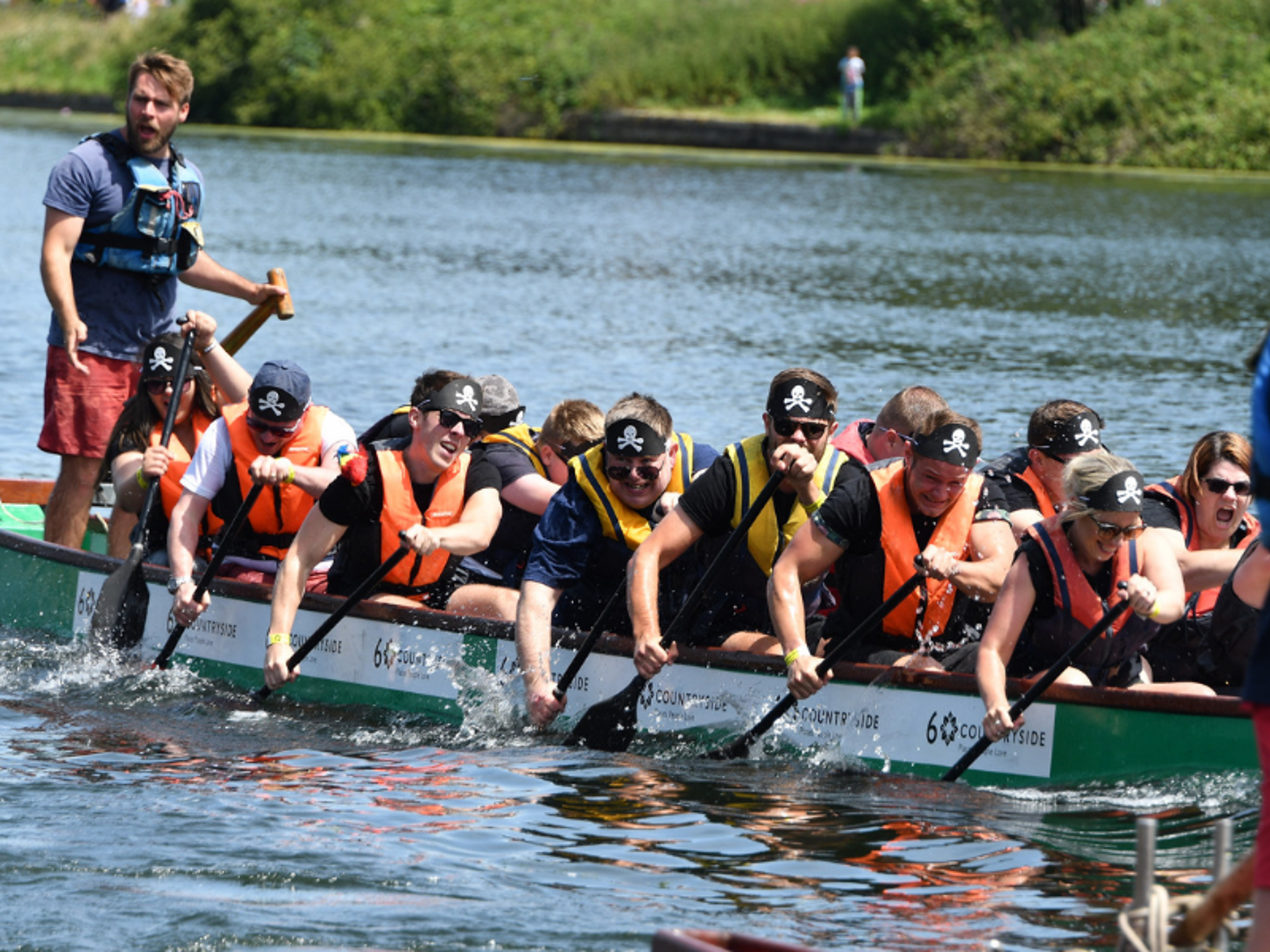 A team taking part in a boat race in aid of WAA A team taking part in a boat race in aid of WAA